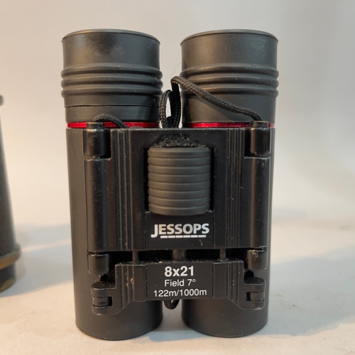 214 - A pair of bakelite opera glasses, a pair of Jesspos 8x21 field glasses and a pair of Foss London bin... 