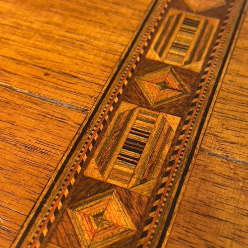 215 - A 19th century walnut writing slope the lid inlaid having a mother of pearl escutcheon, with a fitte... 