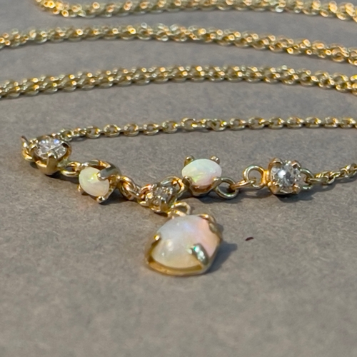 382 - An opal and diamond necklace, the oval and circular cabochon opals, brilliant cut diamonds all claw ... 