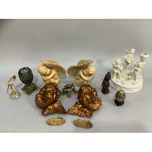 198 - Continental white china cherub group, two gilt cherub face masks, two resin cherubs enamelled frog, ... 