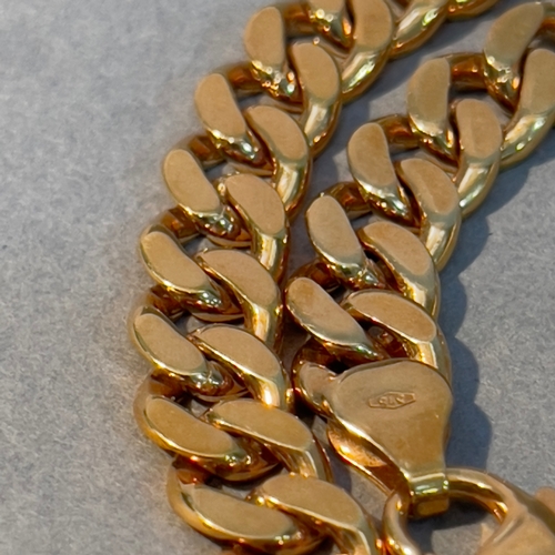 389 - A curb link bracelet in 9ct gold, 
approximate weight 23g