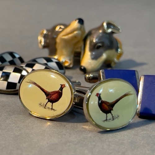 395 - Three pairs of silver cufflinks variously set with enamel, lapis lazuli, onyx and mother of pearl, T... 