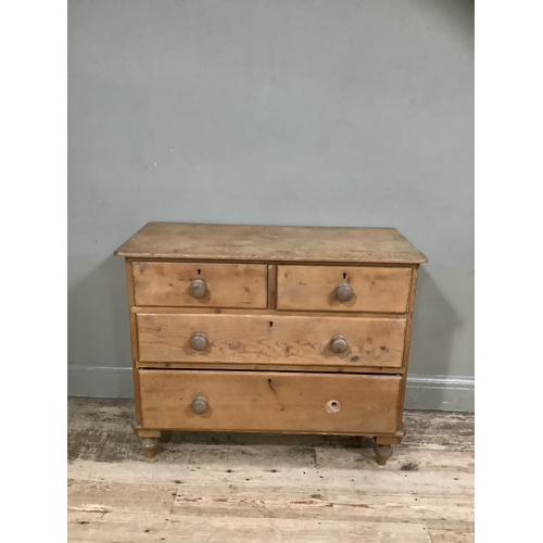 139B - A pine chest of two short above three long drawers on bun feet