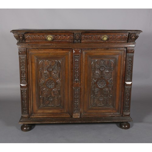 425 - A 19TH CENTURY CONTINENTAL OAK CUPBOARD, having a moulded and writhen lobe carved cornice fitted wit... 