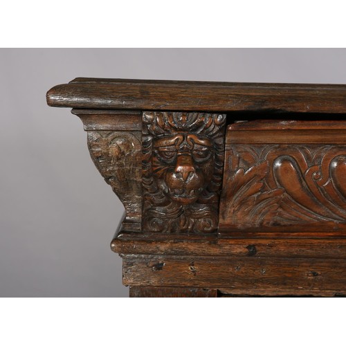 425 - A 19TH CENTURY CONTINENTAL OAK CUPBOARD, having a moulded and writhen lobe carved cornice fitted wit... 