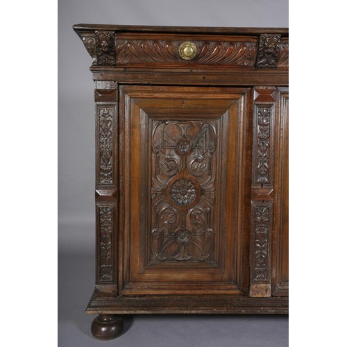 425 - A 19TH CENTURY CONTINENTAL OAK CUPBOARD, having a moulded and writhen lobe carved cornice fitted wit... 