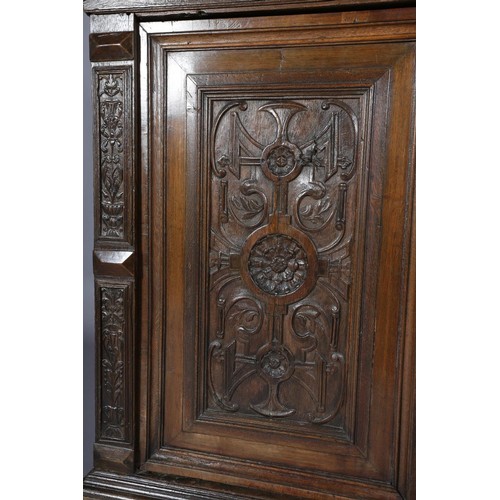 425 - A 19TH CENTURY CONTINENTAL OAK CUPBOARD, having a moulded and writhen lobe carved cornice fitted wit... 