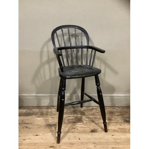 403 - A 19th century ebonised child's Windsor high chair, 86cm high