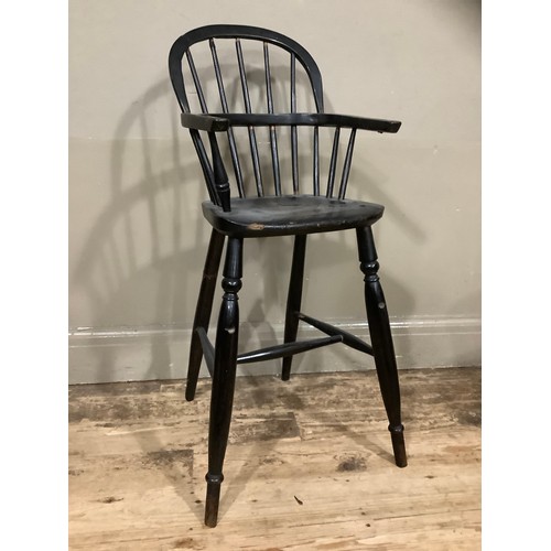 403 - A 19th century ebonised child's Windsor high chair, 86cm high