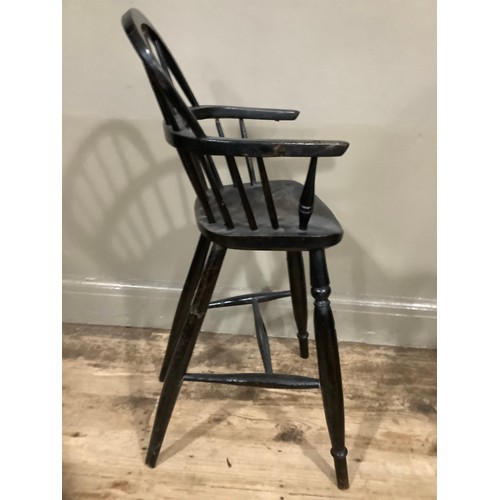 403 - A 19th century ebonised child's Windsor high chair, 86cm high