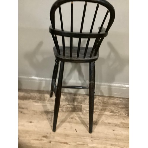 403 - A 19th century ebonised child's Windsor high chair, 86cm high