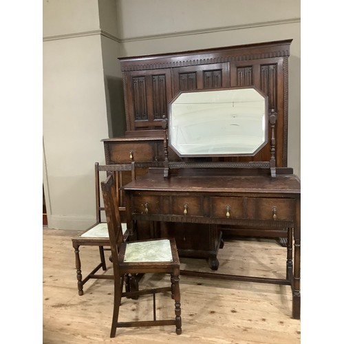 406 - An early 20th century oak bedroom suite by Waring and Gillow of Lancaster comprising triple wardrobe... 