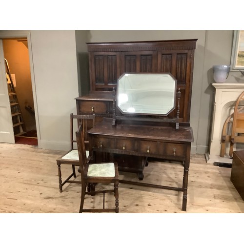 406 - An early 20th century oak bedroom suite by Waring and Gillow of Lancaster comprising triple wardrobe... 