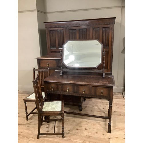 406 - An early 20th century oak bedroom suite by Waring and Gillow of Lancaster comprising triple wardrobe... 