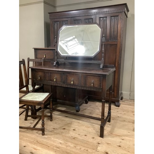 406 - An early 20th century oak bedroom suite by Waring and Gillow of Lancaster comprising triple wardrobe... 