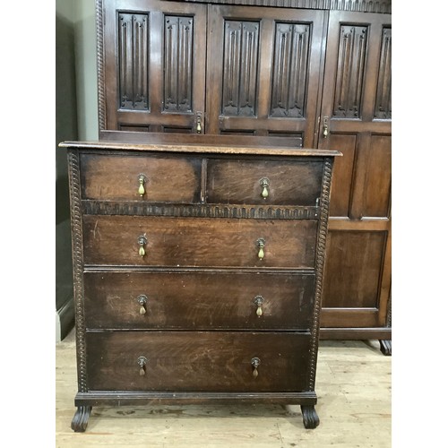 406 - An early 20th century oak bedroom suite by Waring and Gillow of Lancaster comprising triple wardrobe... 