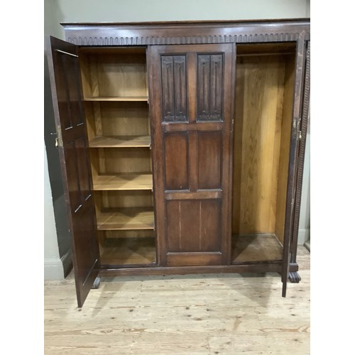 406 - An early 20th century oak bedroom suite by Waring and Gillow of Lancaster comprising triple wardrobe... 