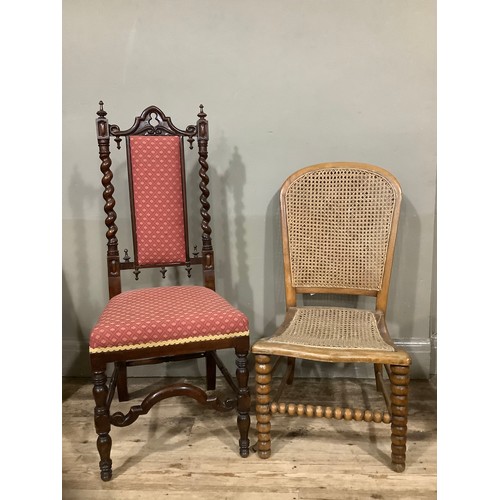 420 - A mahogany carved hall chair with barley twist sides, carved stretcher and having deep red upholster... 