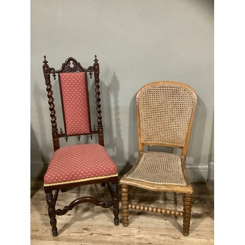 420 - A mahogany carved hall chair with barley twist sides, carved stretcher and having deep red upholster... 