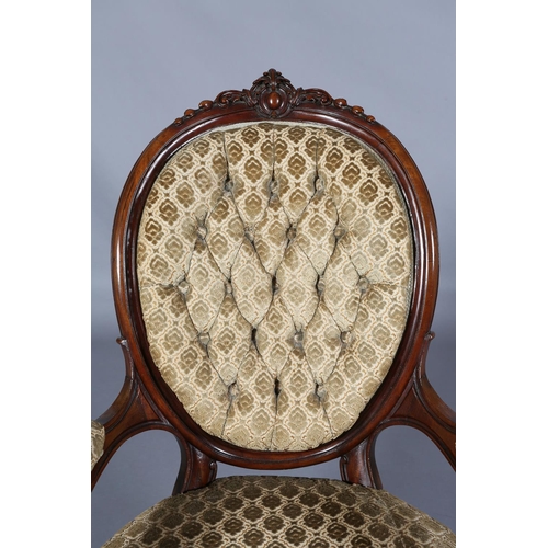 436 - A VICTORIAN MAHOGANY ARMCHAIR having an encircling frame with foliate and harebell cresting, buttone... 