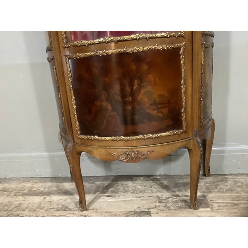 423 - A reproduction walnut and gilt metal mounted vitrine with three glazed panels over romantic scenes, ... 