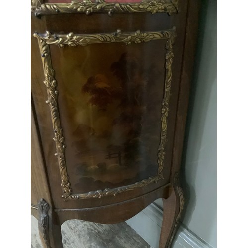 423 - A reproduction walnut and gilt metal mounted vitrine with three glazed panels over romantic scenes, ... 