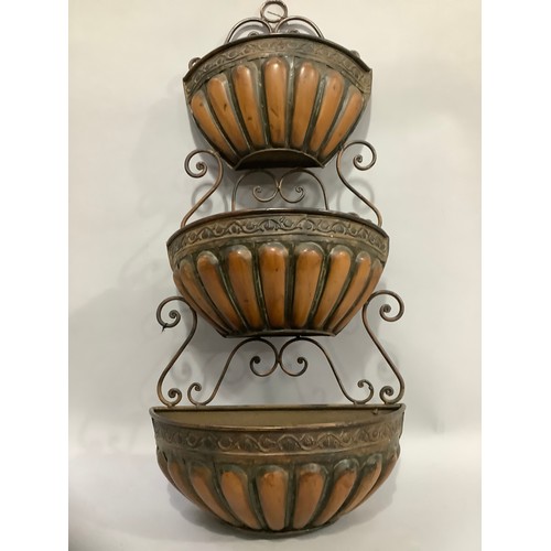 339 - A metal three tier wall planter with scrolled back, 81cm high x 39cm wide