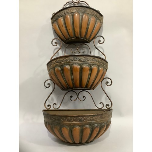 339 - A metal three tier wall planter with scrolled back, 81cm high x 39cm wide