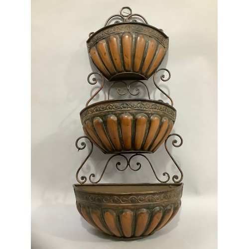 339 - A metal three tier wall planter with scrolled back, 81cm high x 39cm wide