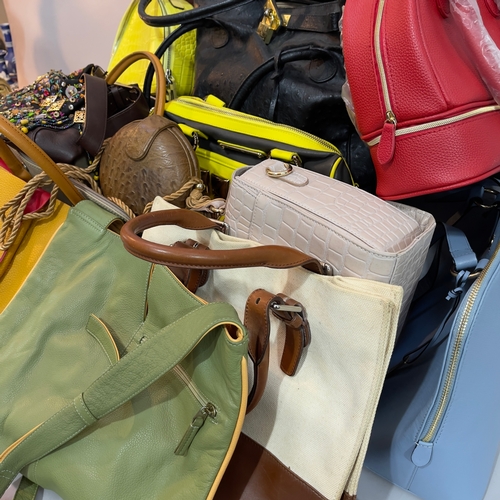 242 - An Elizabeth Arden red handbag, a Radley yellow leather round handbag with shoulder strap, a mustard... 