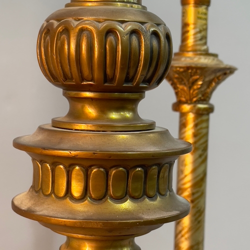 280 - A gilt metal baluster table lamp, on an inverted leaf base with flower head rounders, 54cm high to f... 