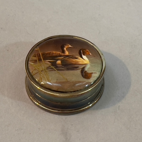 343 - A white metal and enamelled pig in a bucket 3cm, a mouse in a boat 3.75cm, a pill box circular ename... 