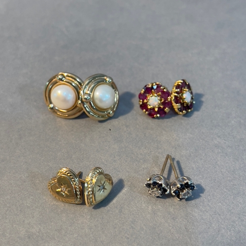 383 - Four pairs of stud earrings all in 9ct gold variously set with fresh water cultured pearls, ruby, op... 