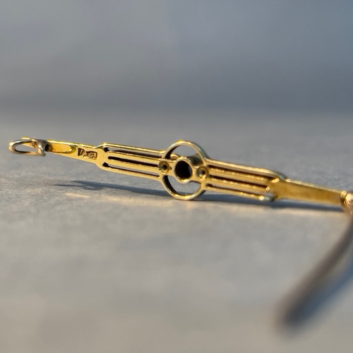 399 - An Art Deco sapphire and seed pearl bar brooch in 15ct gold, collet set to the centre with a circula... 