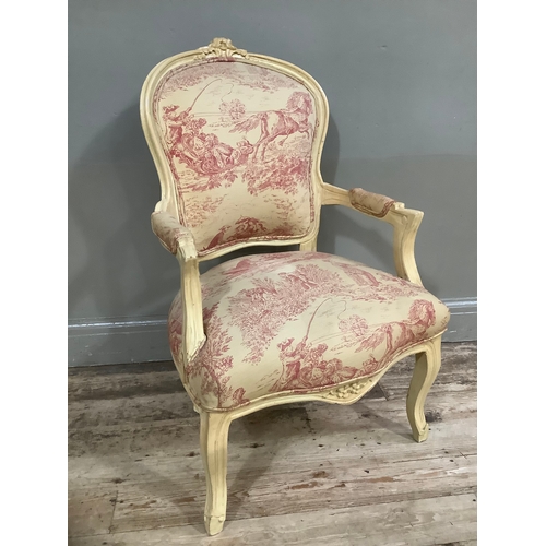 430 - A French style cream painted armchair with carved flower pediment, on cabriole legs in oatmeal and p... 