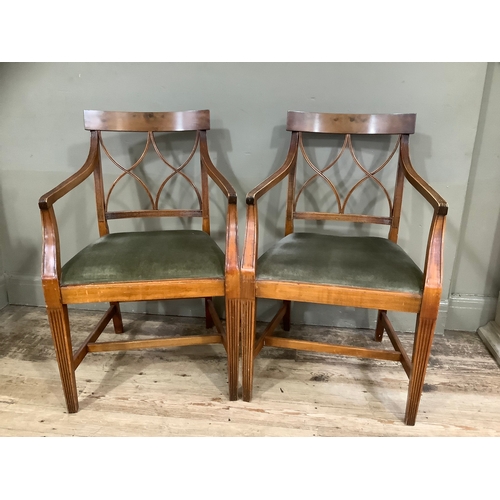 433 - A pair of walnut reproduction Regency style fluted carver chairs upholstered in green fabric