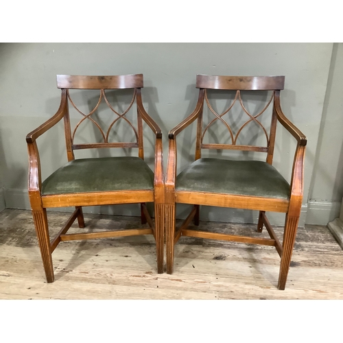 433 - A pair of walnut reproduction Regency style fluted carver chairs upholstered in green fabric