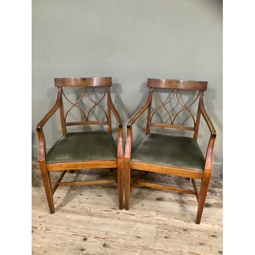 433 - A pair of walnut reproduction Regency style fluted carver chairs upholstered in green fabric