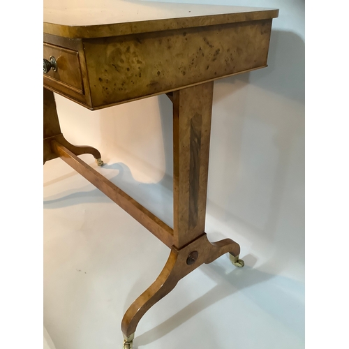 434 - A reproduction burr elm library table having two drawers to the apron, on twin refectory supports an... 