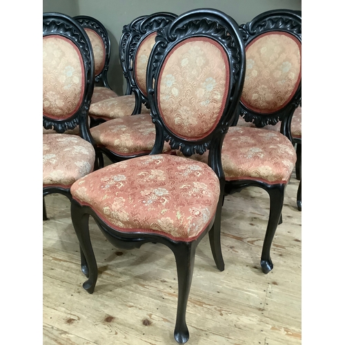 438 - A set of nine 19th century ebonised dining chairs having carved and pierced rocaille cresting above ... 