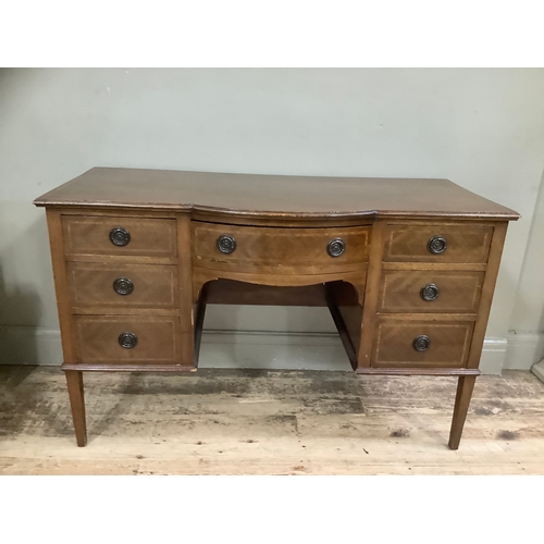 439 - A mahogany inlaid cross banded dressing table having one long drawer surmounted by six short drawers... 