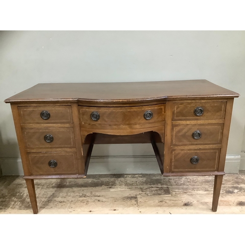 439 - A mahogany inlaid cross banded dressing table having one long drawer surmounted by six short drawers... 