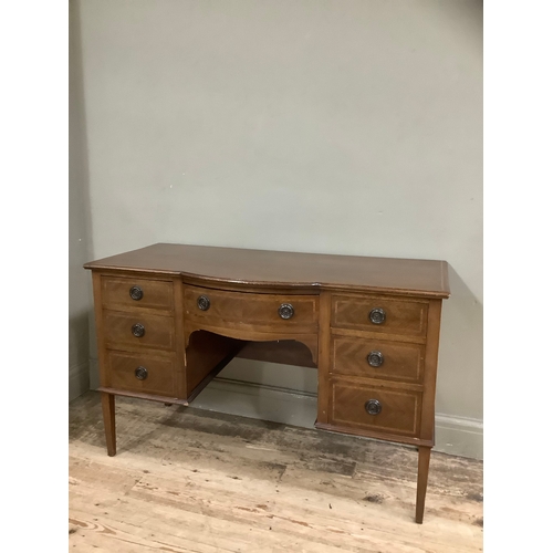 439 - A mahogany inlaid cross banded dressing table having one long drawer surmounted by six short drawers... 