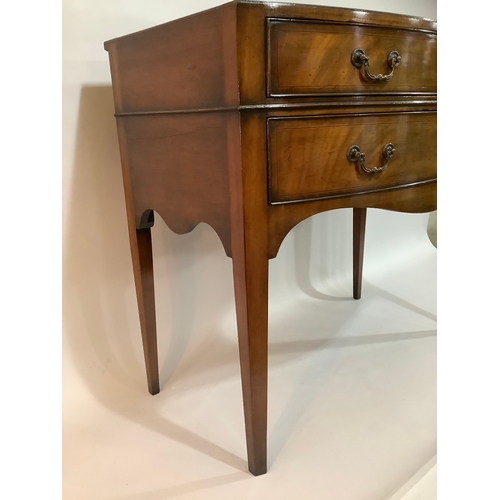 440 - A 1920s mahogany bow fronted side table having two short above one long drawer, on tapered legs, 84c... 