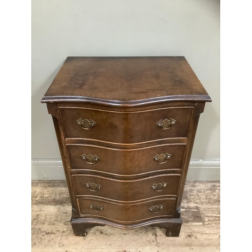 441 - A walnut and mahogany serpentine fronted chest of four long drawers on bracket feet, 50cm wide