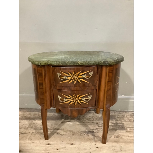 444 - A continental walnut starburst inlaid oval chest with two drawers above cut out apron and with marbl... 