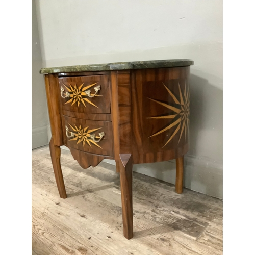 444 - A continental walnut starburst inlaid oval chest with two drawers above cut out apron and with marbl... 