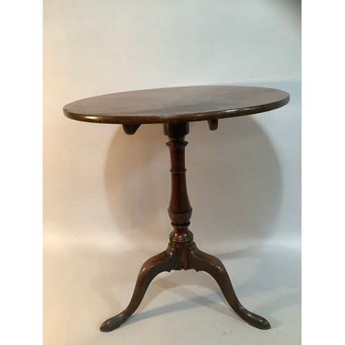 450 - A 19th century mahogany tilt top tripod table measuring 63cm wide