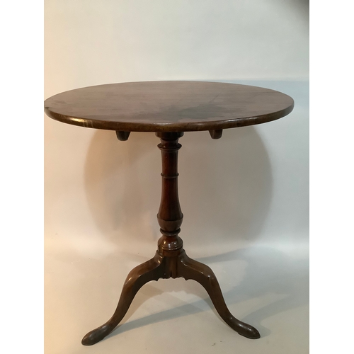 450 - A 19th century mahogany tilt top tripod table measuring 63cm wide