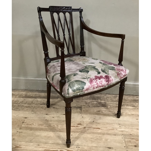 451 - An Edward VII mahogany open armchair with trellis panel to the back, the seat upholstered in floral ... 